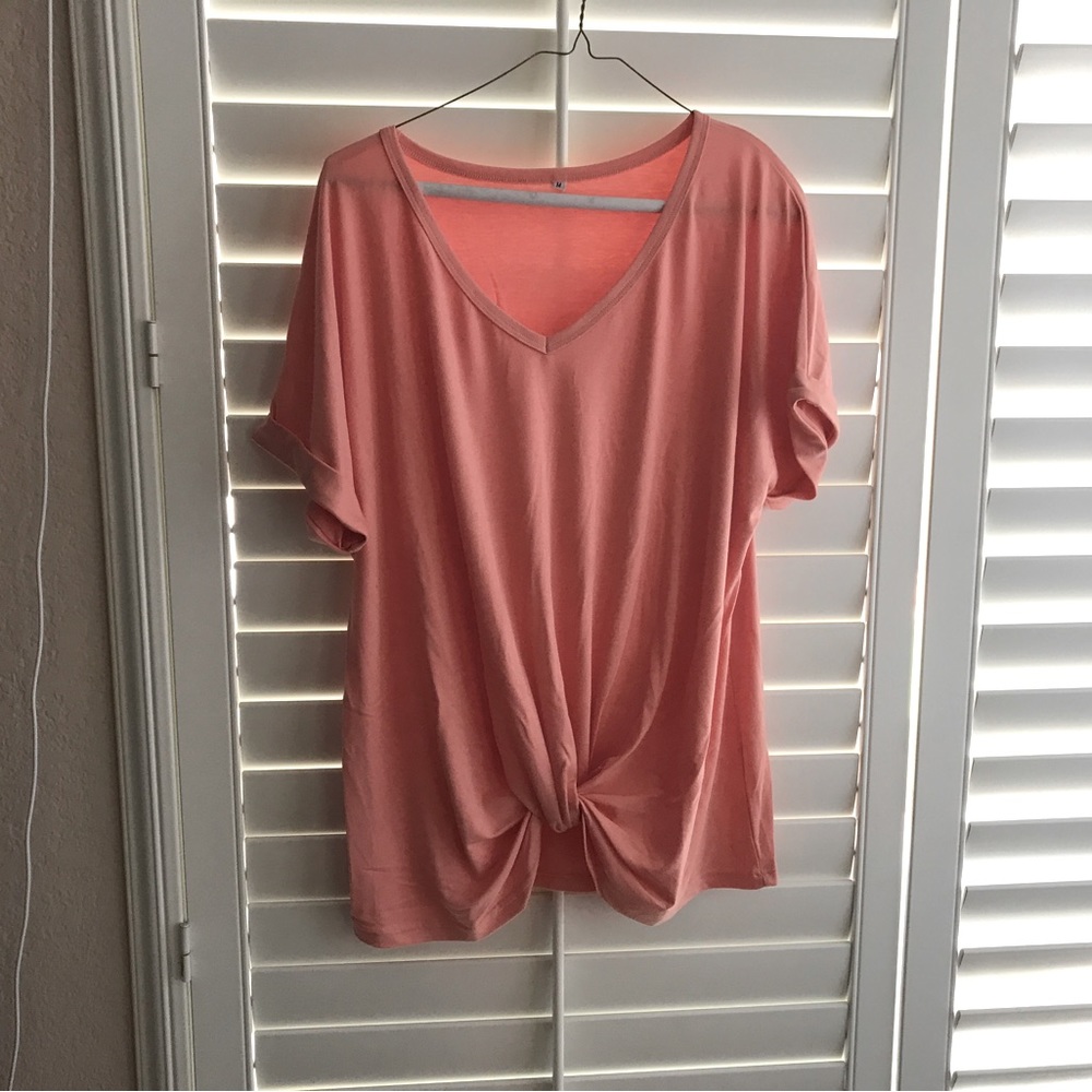 NEW pretty top with knot in the front.